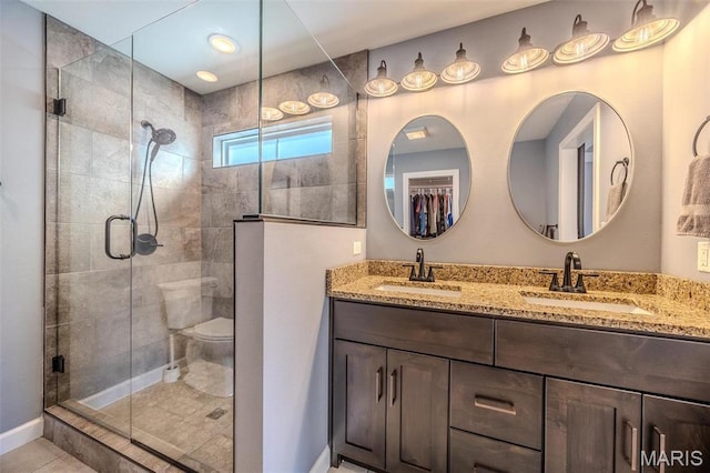 117 Alice Dr, Waynesville, MO 65583 - full bathroom with a stall shower, double vanity, and baseboards