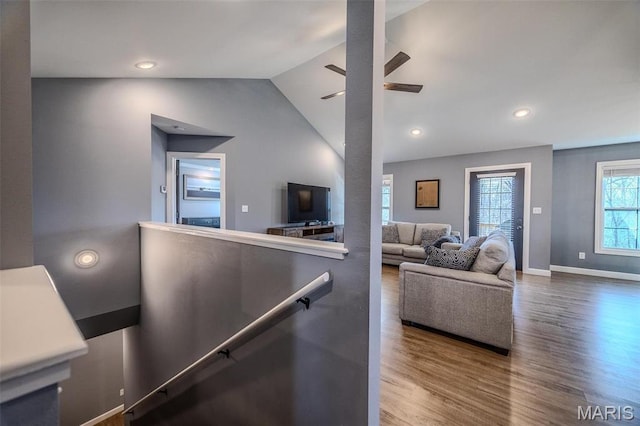 117 Alice Dr, Waynesville, MO 65583 - living room featuring wood finished floors, lofted ceiling, ceiling fan, baseboards, and recessed lighting