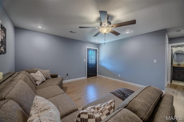 117 Alice Dr, Waynesville, MO 65583 - living area with light wood finished floors, ceiling fan, baseboards, and recessed lighting