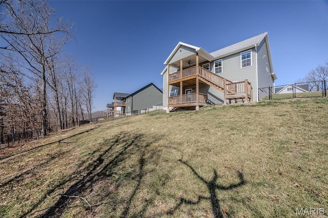 117 Alice Dr, Waynesville, MO 65583 - back of house featuring a ceiling fan, stairway, and a wooden deck