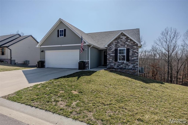117 Alice Dr, Waynesville, MO 65583 - view of front of home featuring concrete driveway, a front lawn, board and batten siding, a garage, and stone siding