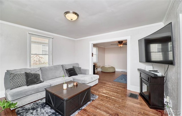 125 Lithia Ave, Saint Louis, MO 63119 - living room featuring ornamental molding, wood finished floors, a ceiling fan, and baseboards
