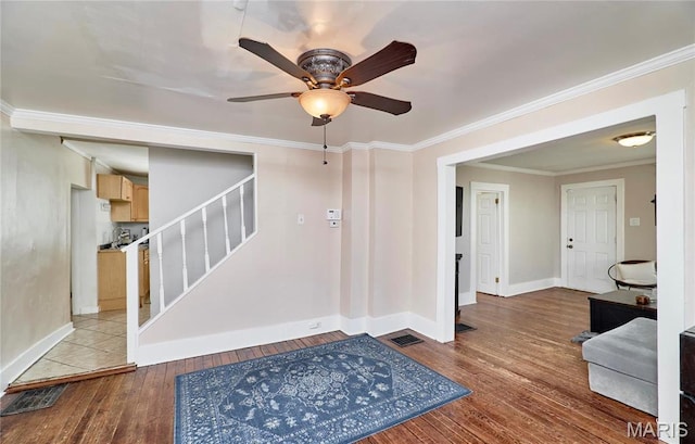 125 Lithia Ave, Saint Louis, MO 63119 - entryway featuring hardwood / wood-style floors, stairs, baseboards, a ceiling fan, and crown molding