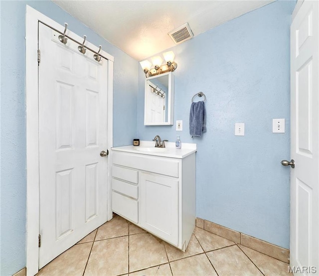 125 Lithia Ave, Saint Louis, MO 63119 - bathroom with vanity, tile patterned floors, and baseboards