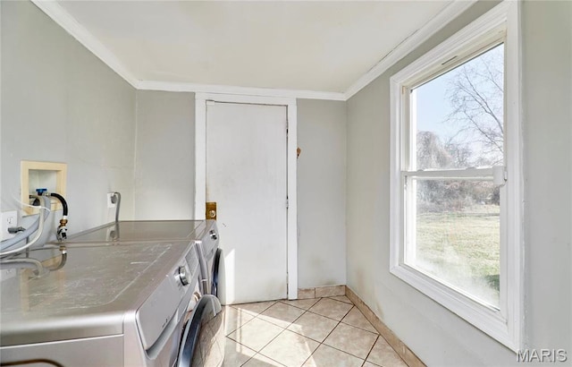 125 Lithia Ave, Saint Louis, MO 63119 - washroom featuring ornamental molding, healthy amount of natural light, independent washer and dryer, and light tile patterned floors