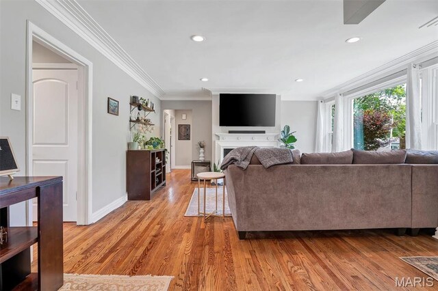 927 Gay Ave, Saint Louis, MO 63130 - living area with wood finished floors, ornamental molding, baseboards, and recessed lighting