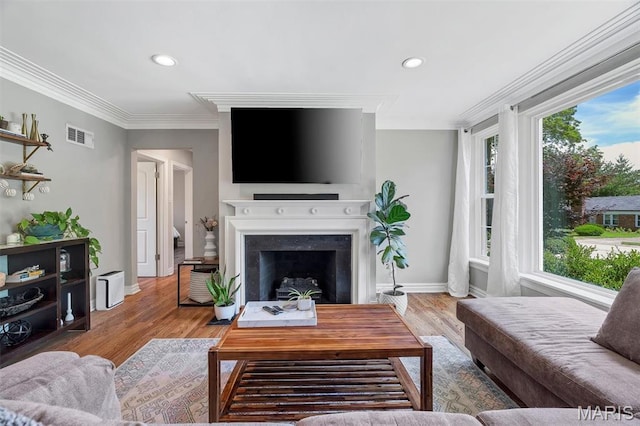 927 Gay Ave, Saint Louis, MO 63130 - living area featuring wood finished floors, recessed lighting, a fireplace, baseboards, and crown molding
