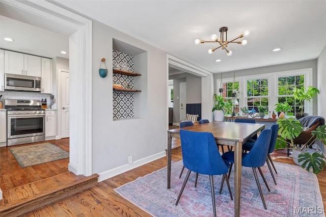 927 Gay Ave, Saint Louis, MO 63130 - dining space featuring a chandelier, wood finished floors, baseboards, and recessed lighting
