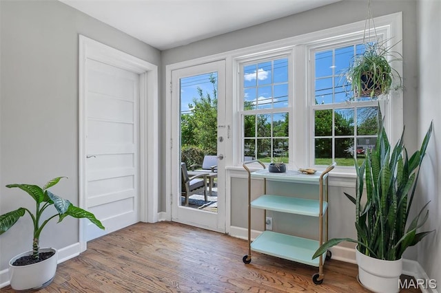 927 Gay Ave, Saint Louis, MO 63130 - doorway to outside featuring wood finished floors and baseboards