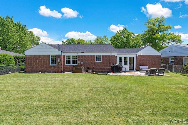 927 Gay Ave, Saint Louis, MO 63130 - rear view of property with brick siding and a patio area