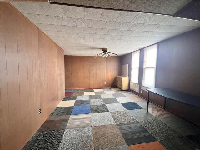 601 S Elm St, Center, MO 63436 - unfurnished room with a ceiling fan and wood walls