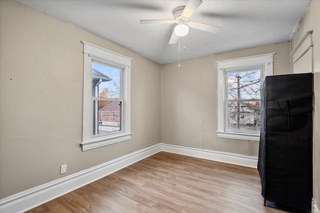 2152 State St, Granite City, IL 62040 - unfurnished room featuring healthy amount of natural light, baseboards, light wood-type flooring, and ceiling fan