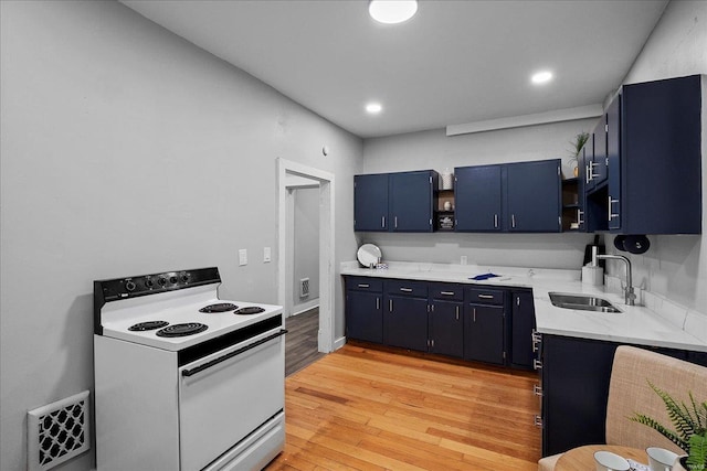 2152 State St, Granite City, IL 62040 - kitchen featuring white range with electric stovetop, blue cabinetry, open shelves, a sink, and light wood-style floors