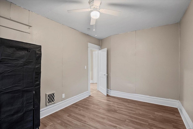 2152 State St, Granite City, IL 62040 - unfurnished bedroom featuring wood finished floors, baseboards, and ceiling fan
