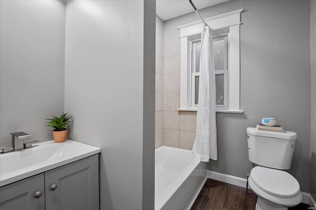 2152 State St, Granite City, IL 62040 - full bath featuring toilet, wood finished floors, vanity, baseboards, and shower / tub combination