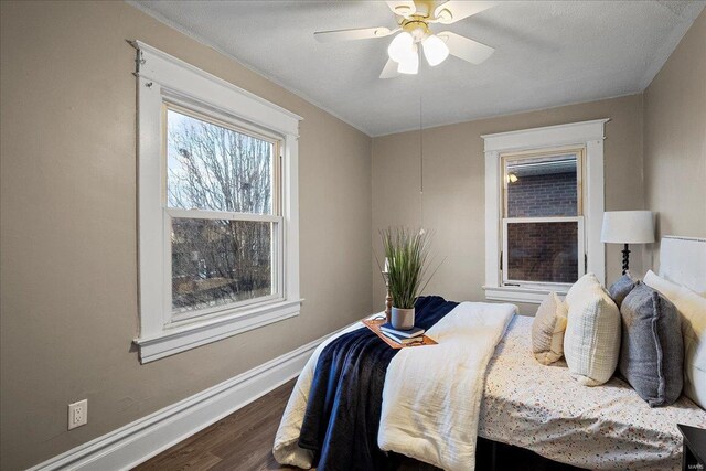 2152 State St, Granite City, IL 62040 - bedroom with dark wood-style flooring, baseboards, and a ceiling fan