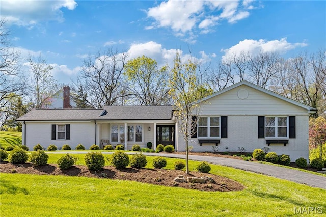 502 Briar Ridge Ln, Saint Louis, MO 63131 - single story home with a chimney, a front yard, and brick siding