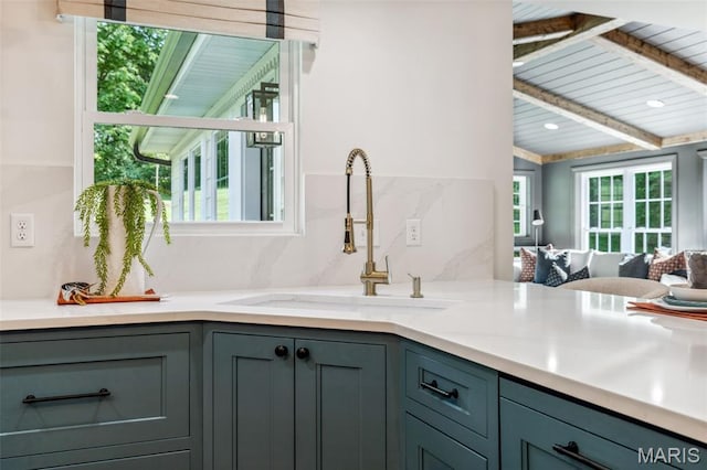 502 Briar Ridge Ln, Saint Louis, MO 63131 - kitchen with a sink, gray cabinets, healthy amount of natural light, light countertops, and beamed ceiling