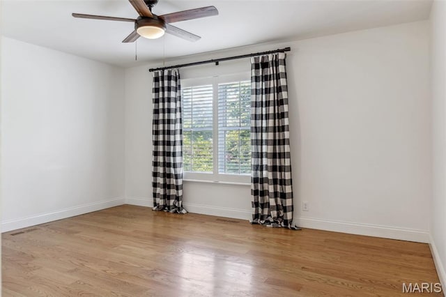 502 Briar Ridge Ln, Saint Louis, MO 63131 - unfurnished room featuring a ceiling fan, wood finished floors, and baseboards