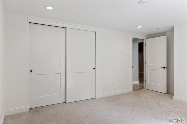 502 Briar Ridge Ln, Saint Louis, MO 63131 - unfurnished bedroom with baseboards, light carpet, a closet, and recessed lighting