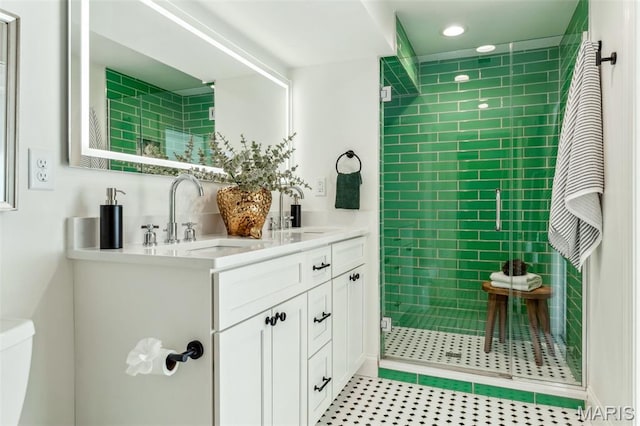 502 Briar Ridge Ln, Saint Louis, MO 63131 - full bath featuring a stall shower, double vanity, recessed lighting, toilet, and tile patterned flooring