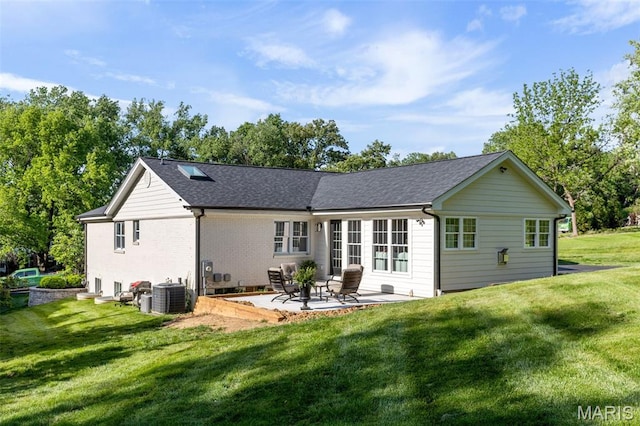 502 Briar Ridge Ln, Saint Louis, MO 63131 - back of house featuring a patio area, cooling unit, a lawn, and roof with shingles