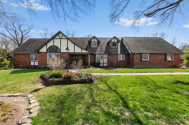 167 Red Fox Ln, Cape Girardeau, MO 63701 - tudor-style house featuring brick siding and a front lawn