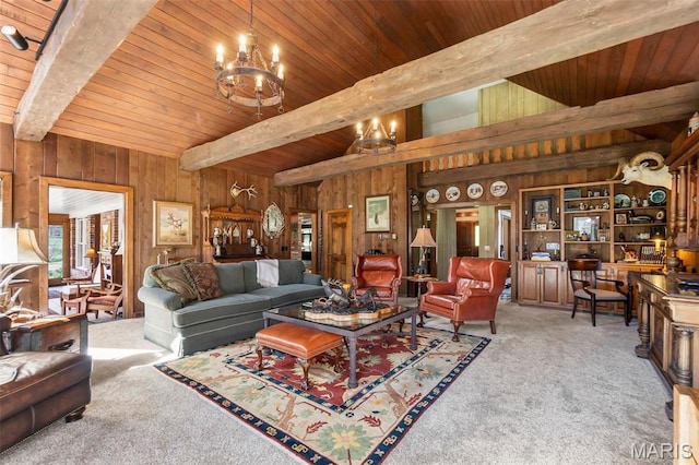 167 Red Fox Ln, Cape Girardeau, MO 63701 - living room featuring beam ceiling, wooden walls, carpet flooring, and a chandelier