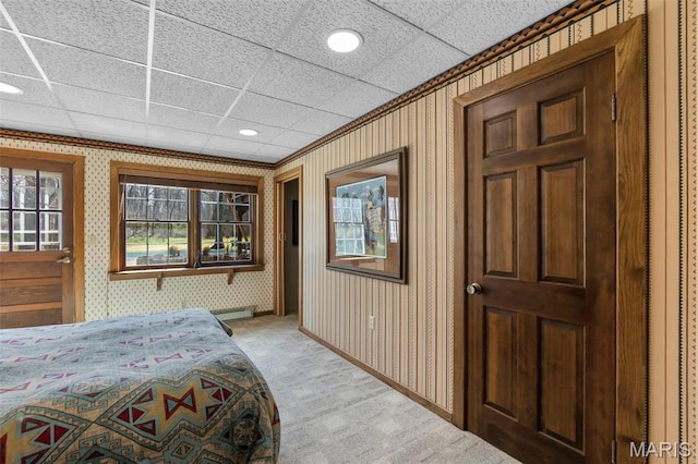 167 Red Fox Ln, Cape Girardeau, MO 63701 - bedroom with a baseboard heating unit, wallpapered walls, recessed lighting, light colored carpet, and baseboards