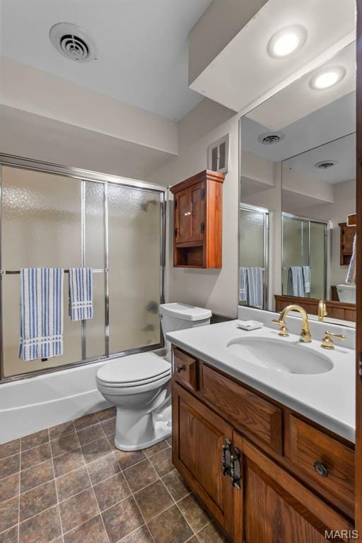 167 Red Fox Ln, Cape Girardeau, MO 63701 - full bathroom with toilet, enclosed tub / shower combo, vanity, and tile patterned flooring