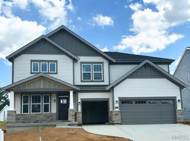 6730 Snowy Owl Ln, Affton, MO 63123 - craftsman house featuring board and batten siding, driveway, and stone siding