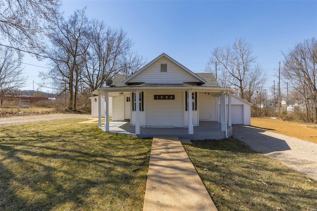 1005 Tyler St, Park Hills, MO 63601 - view of front of property with a porch, a front yard, a shingled roof, and gravel driveway