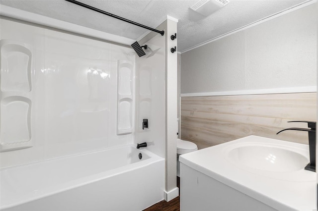 1005 Tyler St, Park Hills, MO 63601 - bathroom with a textured wall, tub / shower combination, a textured ceiling, wood finished floors, and vanity