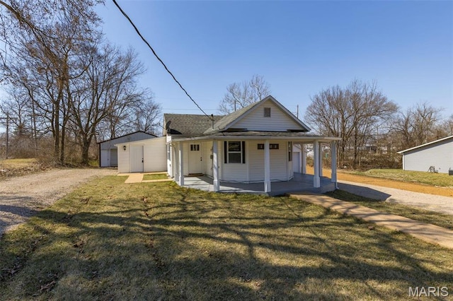 1005 Tyler St, Park Hills, MO 63601 - farmhouse inspired home with a porch, a front lawn, driveway, and a shingled roof