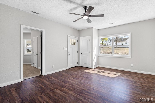 1005 Tyler St, Park Hills, MO 63601 - unfurnished bedroom with wood finished floors, a textured ceiling, baseboards, and ceiling fan