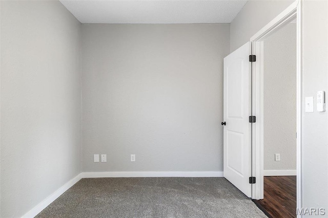 1005 Tyler St, Park Hills, MO 63601 - spare room featuring dark colored carpet and baseboards