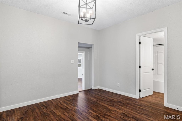 1005 Tyler St, Park Hills, MO 63601 - empty room with a chandelier, wood finished floors, and baseboards