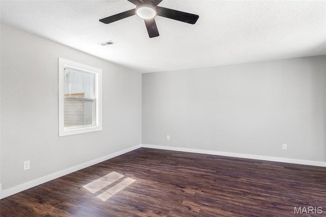 1005 Tyler St, Park Hills, MO 63601 - unfurnished room with wood finished floors, a ceiling fan, and baseboards