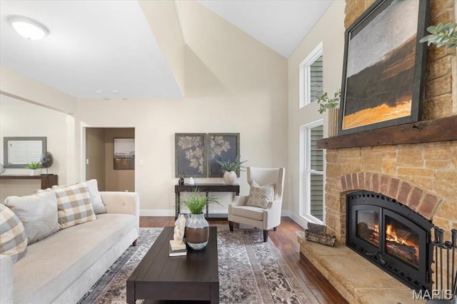 115 Place De Yeager, Lake St Louis, MO 63367 - living room featuring wood finished floors, a large fireplace, and baseboards