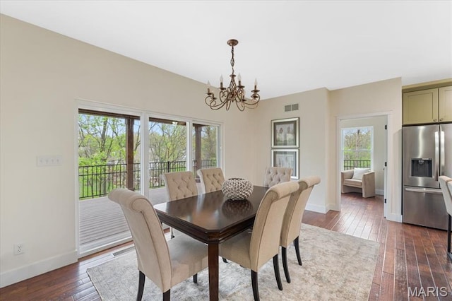 115 Place De Yeager, Lake St Louis, MO 63367 - dining room with a chandelier, dark wood-style flooring, and baseboards