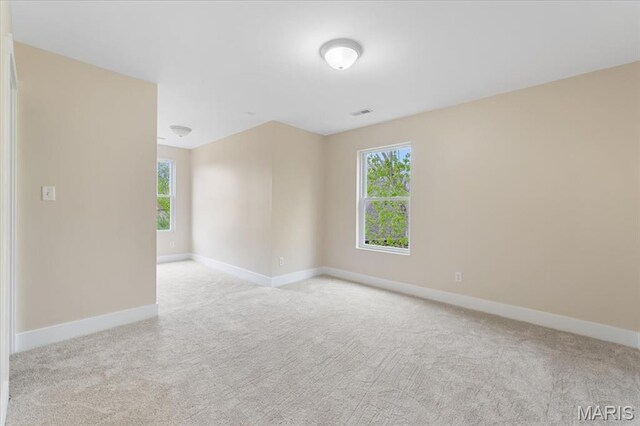 115 Place De Yeager, Lake St Louis, MO 63367 - carpeted empty room featuring baseboards and plenty of natural light