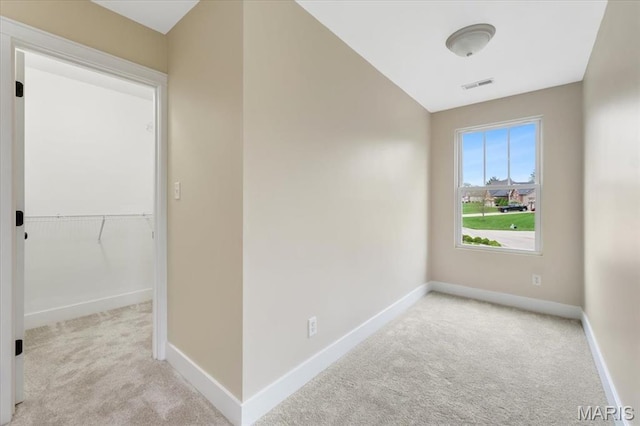 115 Place De Yeager, Lake St Louis, MO 63367 - spare room featuring carpet floors and baseboards