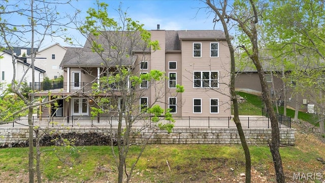 115 Place De Yeager, Lake St Louis, MO 63367 - back of house with fence and a shingled roof