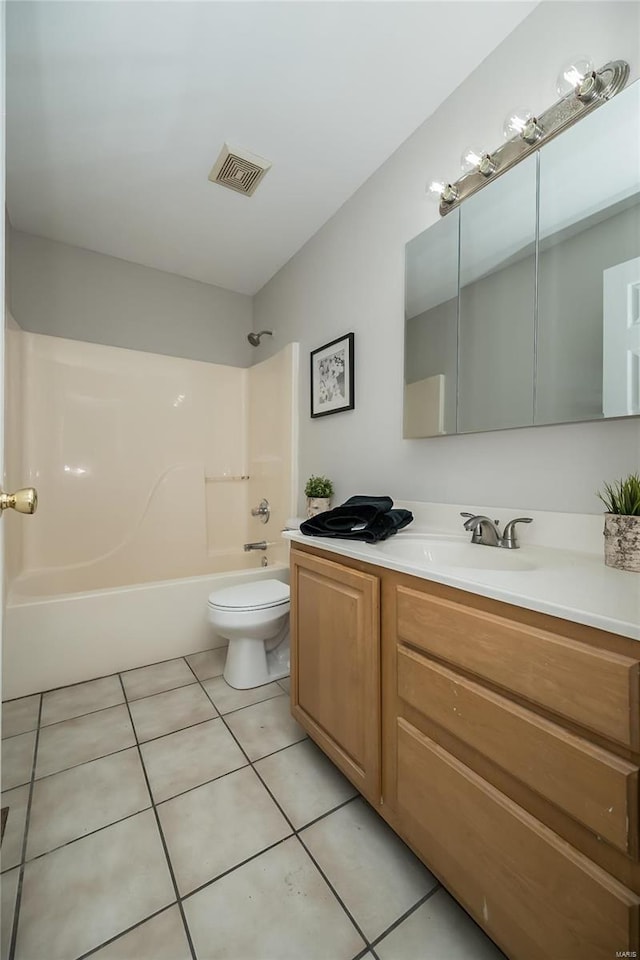 133 Lithia Ave, Saint Louis, MO 63119 - bathroom featuring toilet, tub / shower combination, tile patterned floors, and vanity