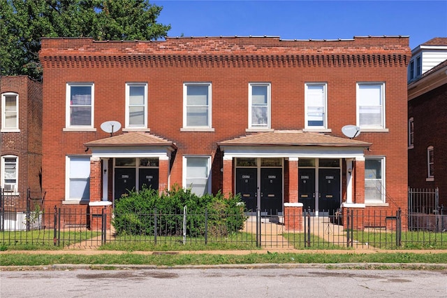 4515 Margaretta Ave, Saint Louis, MO 63115 - view of front facade featuring brick siding and a fenced front yard