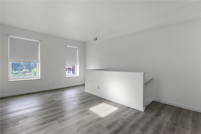 4515 Margaretta Ave, Saint Louis, MO 63115 - spare room featuring wood finished floors and baseboards