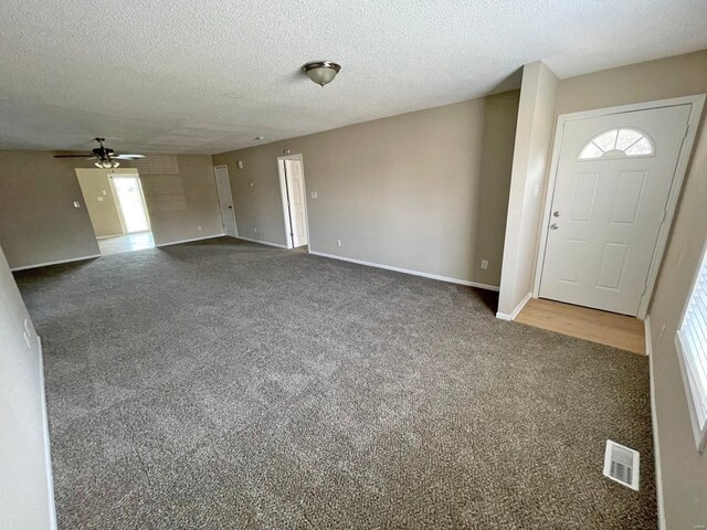 12 Lynnwood Ct, Belleville, IL 62226 - carpeted foyer entrance featuring a ceiling fan, a textured ceiling, and baseboards