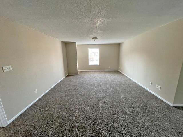 12 Lynnwood Ct, Belleville, IL 62226 - unfurnished room with carpet, baseboards, and a textured ceiling