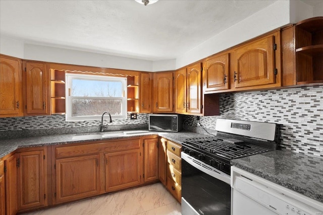 kitchen with open shelves, appliances with stainless steel finishes, and brown cabinetry