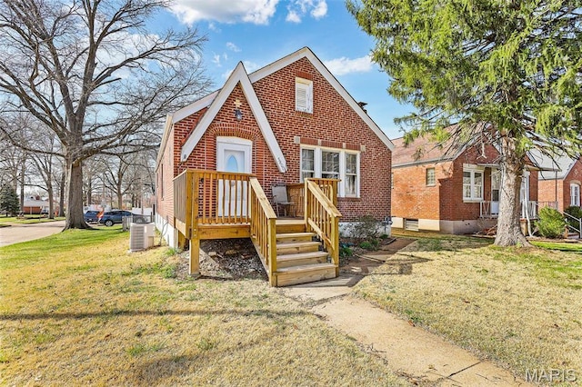 5800 Marquette Ave, Saint Louis, MO 63139 - tudor home with a front yard, brick siding, and central AC